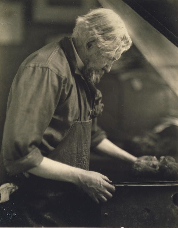 Joseph Pennell working at a printing press