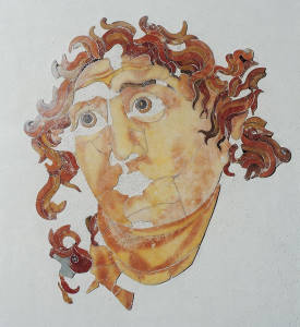 Head of Helios depicted in polychrome marble inlays, located in the Santa Prisca Mithraeum. Testa di Helios.jpg