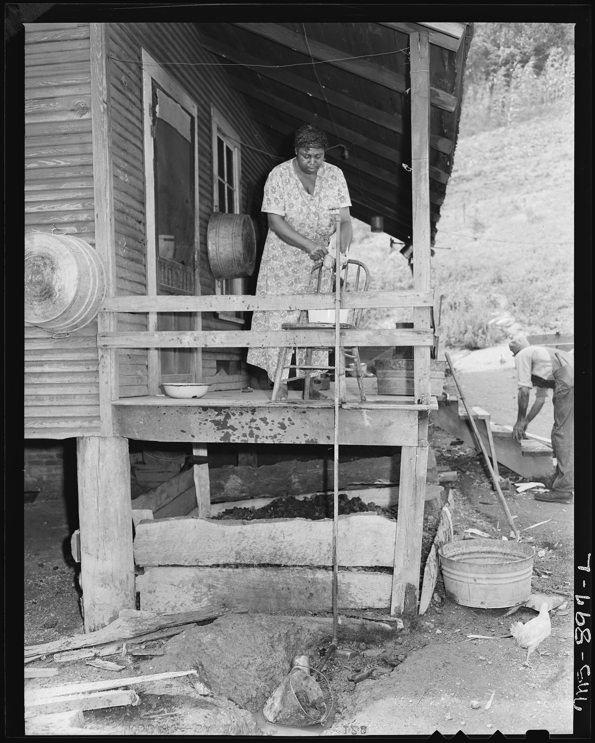 File:Mrs. Butler Phillips, wife of miner, dressing a ...