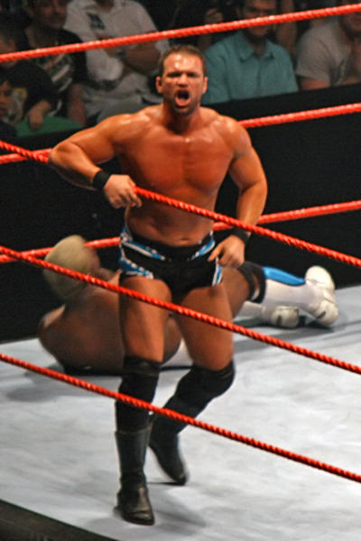 Haas calls to the crowd following a hot tag from long-time partner Shelton Benjamin in late 2007.