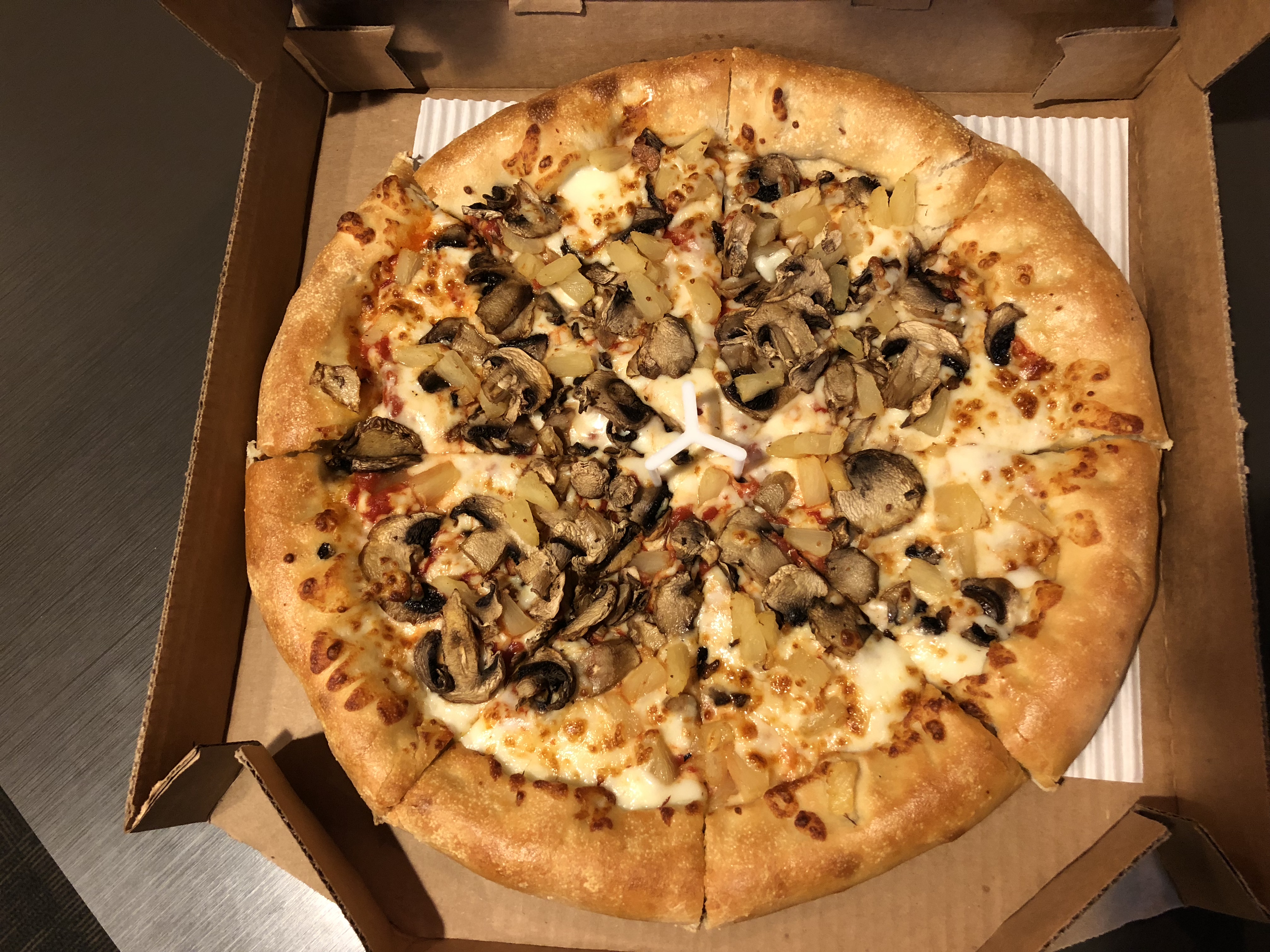 2019-02-26 22 49 34 A large Pizza Hut stuffed crust pizza with mushrooms an...