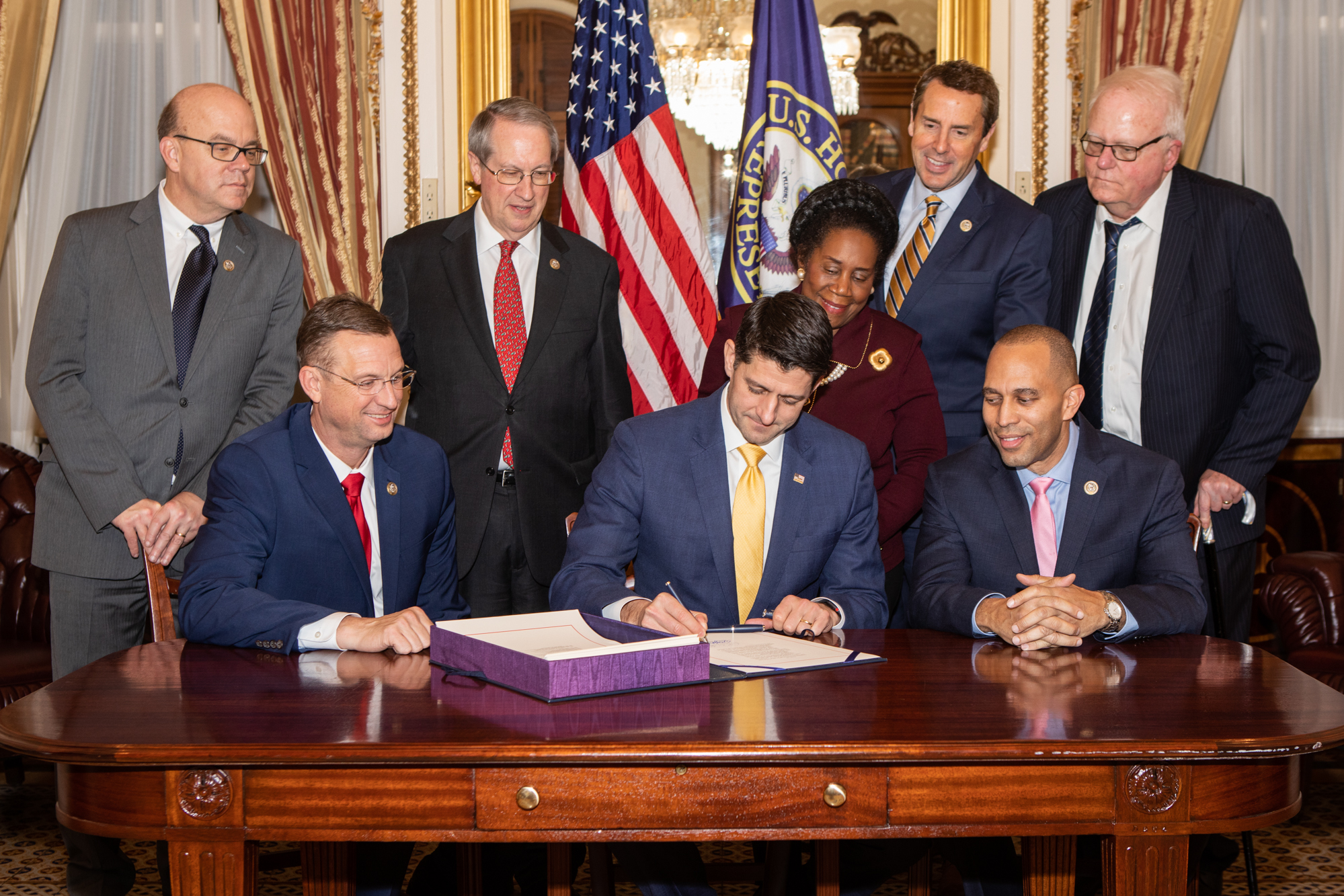 Paul Ryan signs the First Step Act with Collins, Jeffries, and congressional leaders.