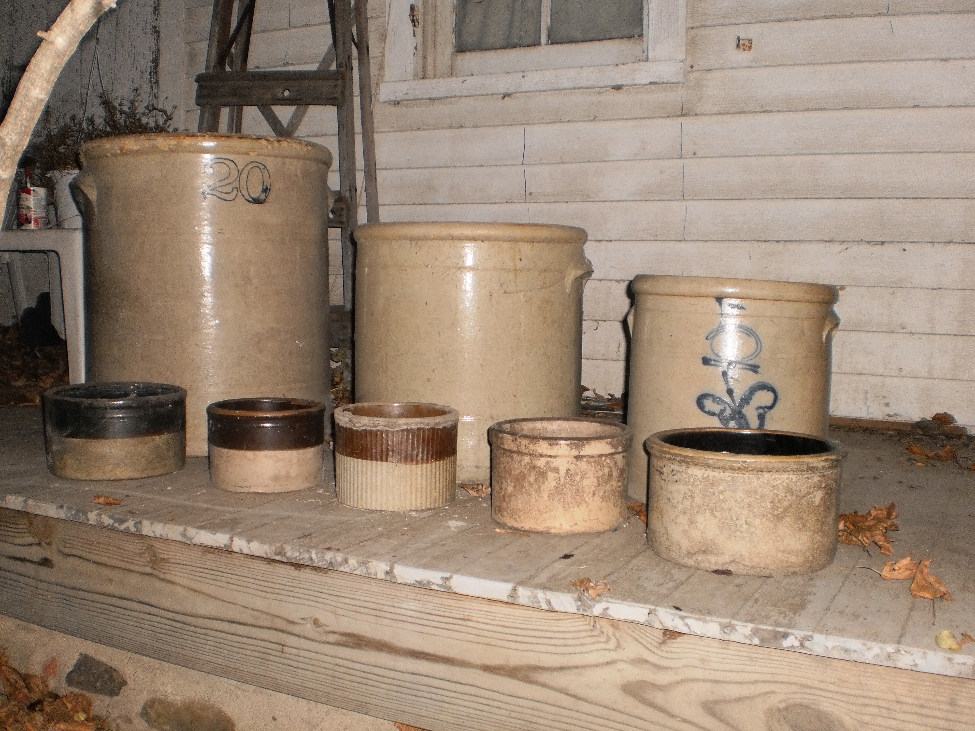 8 antique stoneware crocks.JPG. 