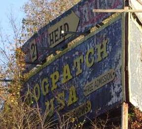 A faded billboard advertises free admission at Dogpatch USA. The free admission policy was introduced in 1991. Dogpatch USA.JPG