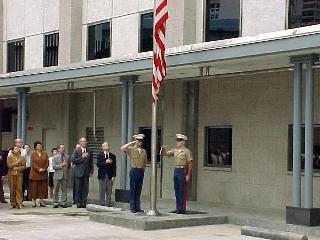 U.S. Marines at the United States consulate-general in Hong Kong lower the American flag out of respect for the 1999 Chinese embassy bombing victims.[63]