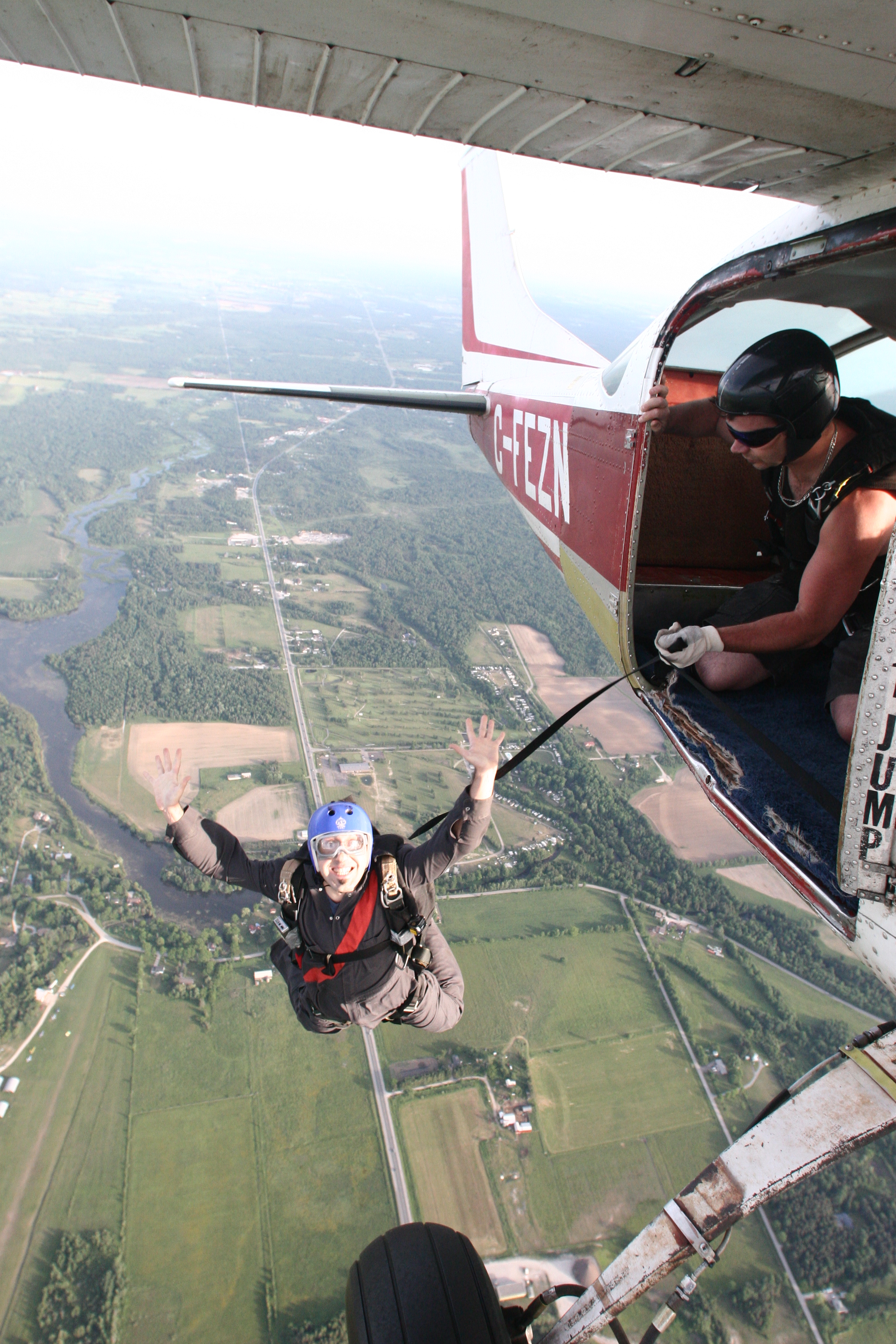 File:Skydiver exiting aircraft with static line still attached.jpg