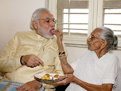 Modi being fed by his mother