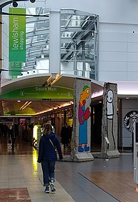 The museum's entrance in Lewisham Shopping Centre with the sculpture Wall Migration Museum, London, "Wall".png