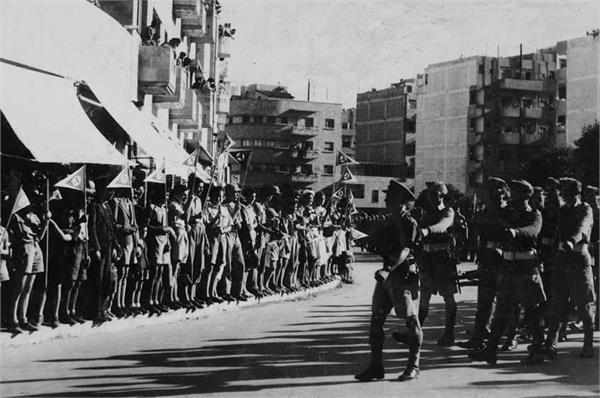 File:תהלוכת חיילים בירושלים ביום הקיסרות הבריטית-JNF006499.jpeg