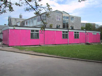 The modular building that was painted pink as part of a prank on "muck-up day" in 2002 Pinkhut.jpg