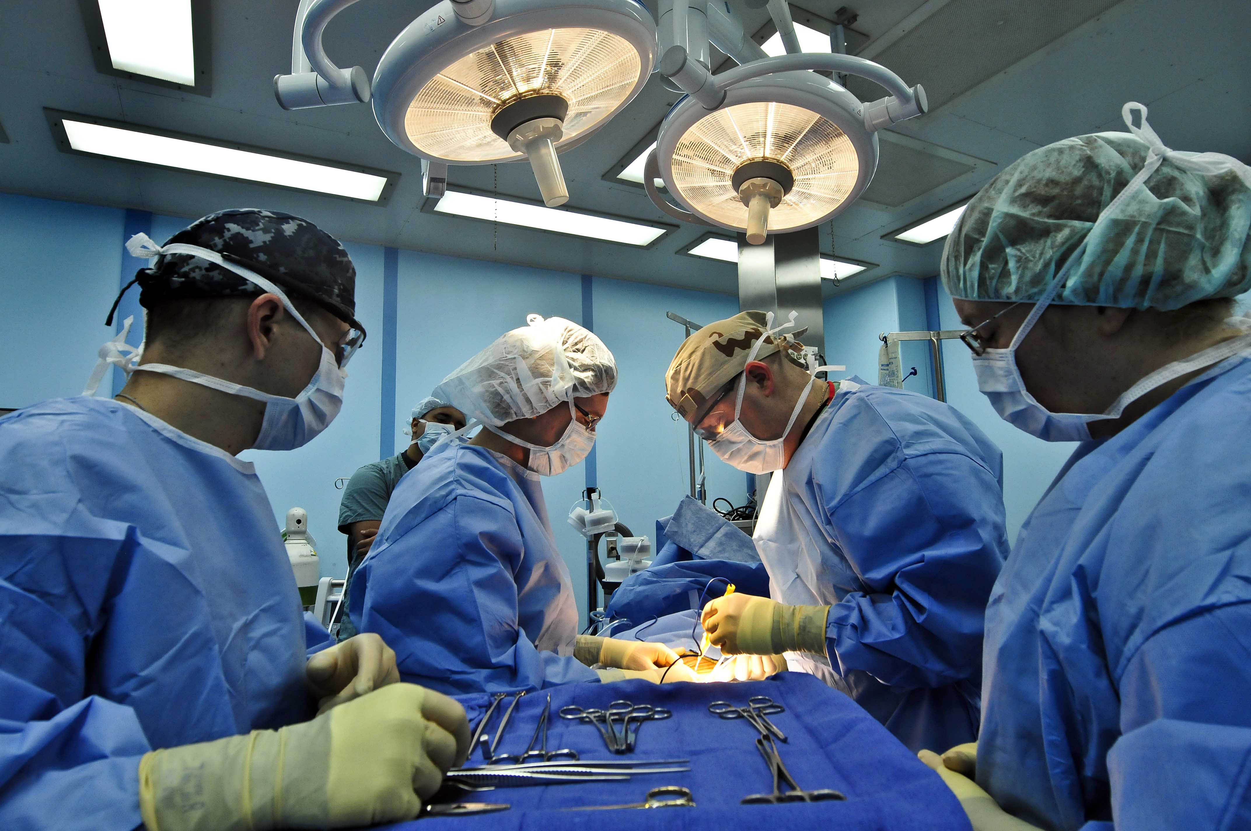 Flickr - Official U.S. Navy Imagery - Doctors perform surgery together..jpg...