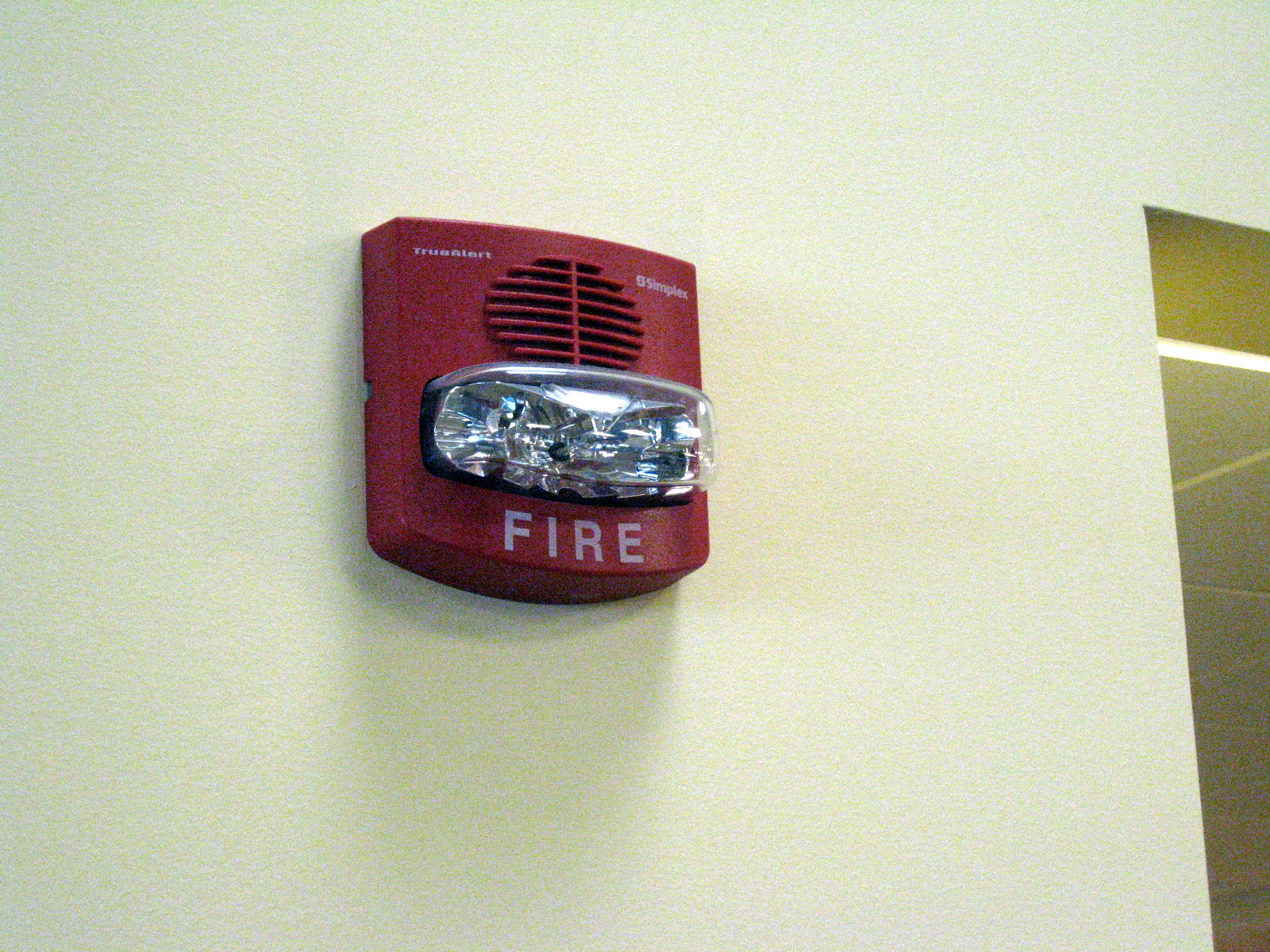 How can I make my apartment fire alarm quieter?