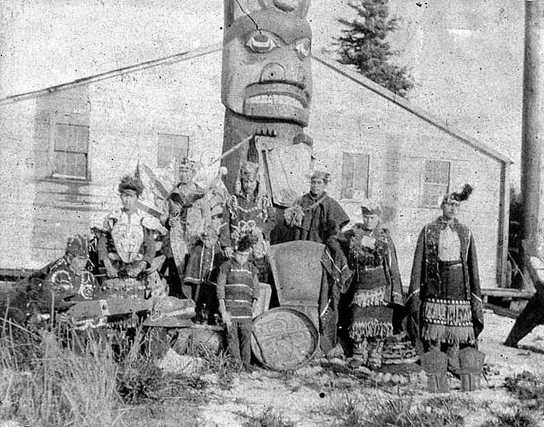 File:Tlingit men and boy in traditional costumes standing in front of totem pole, Fort Tongass, Dec 14, 1887 (AL+CA 621).jpg