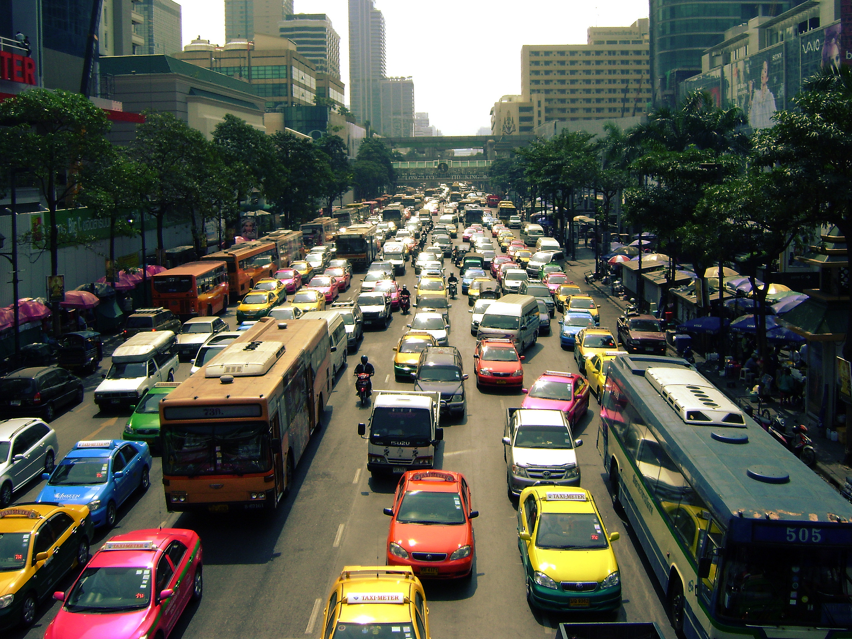 Transport in Thailand is varied, with no one dominant means of transport. For long distance travel, bus transport dominates. Low-speed rail travel has long been a rural long-distance transport mechanism, though plans are underway to expand services with high-speed rail lines extending to several major regions of Thailand. Road transportation is the primary form of freight transport across the country.
For short trips motorbikes are common. There are public motorcycle taxis in Bangkok, Pattaya, and other large cities. An overwhelming number of taxis can also be found in Bangkok.  Since the country's first rapid rail transit line opened in 1999 in Bangkok, daily ridership on Bangkok's various transit lines has risen to over 800,000, with multiple additional lines either under construction or being proposed.
Private automobiles, whose rapid growth contributed to Bangkok's notorious traffic congestion over the past two decades, have risen in popularity, especially among tourists, expats, the upper class, and the growing middle class. A motorway network across Thailand has been gradually implemented, with motorways completed in Bangkok and most of central Thailand.
Domestic air transport, which had been dominated by a select few air carriers, saw a surge in popularity since 2010 due in large part to the expanding services of low-cost carriers such as Thai Air Asia and Nok Air.
Areas with navigable waterways often have boats or boat service, and many innovative means of transport exist such as tuk-tuk, vanpool, songthaew, and even elephants in rural areas.