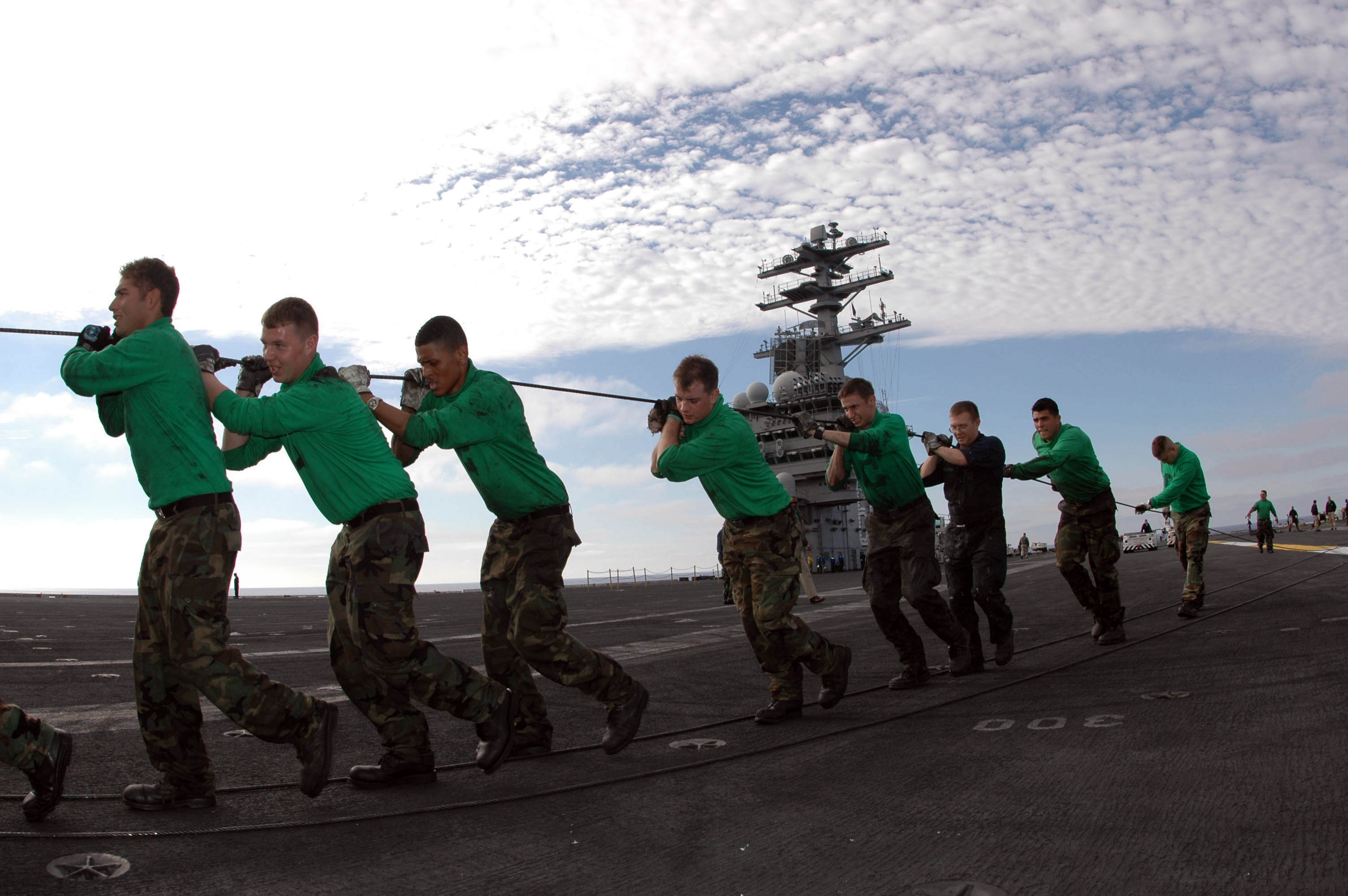 US_Navy_050121-N-2143T-005_Air_Department_personnel_pull-out_a_cable_used_inside_the_steam-powered_catapults_for_routine_maintenance_and_replacement_aboard_the_aircraft_carrier_USS_Nimitz_%28CVN_68%29.jpg