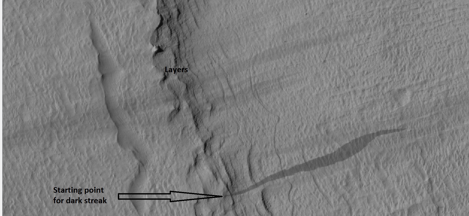 Close-up of some layers under cap rock of a pedestal crater and a dark slope streak