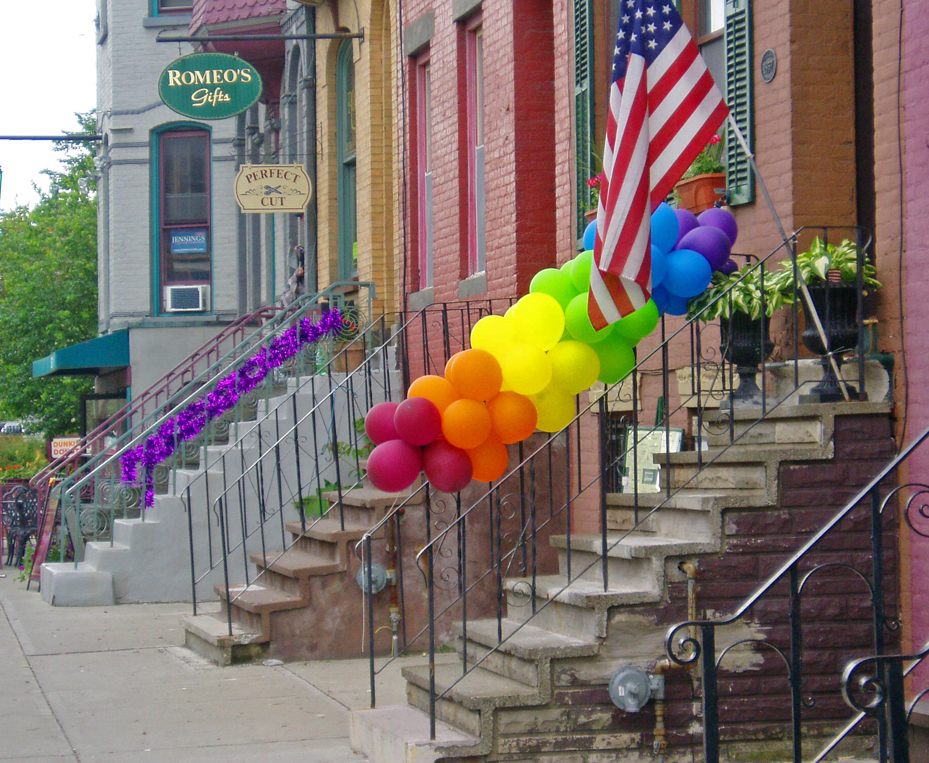 Commons:A. Gay pride balloons and ribbon on stoop railings, Lark Street, Al...