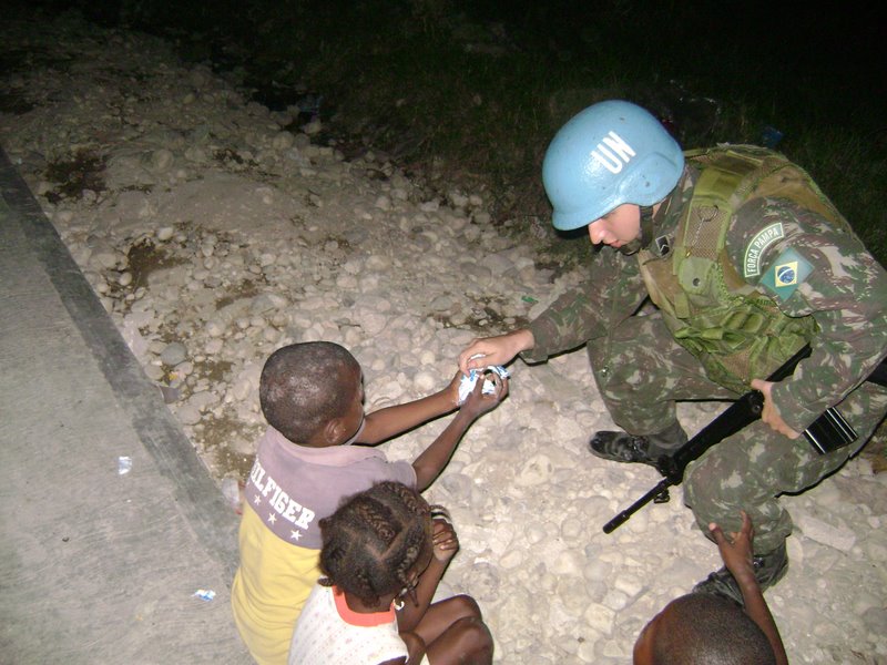 File:Brazilian Soldier in Haiti giving candies.jpg