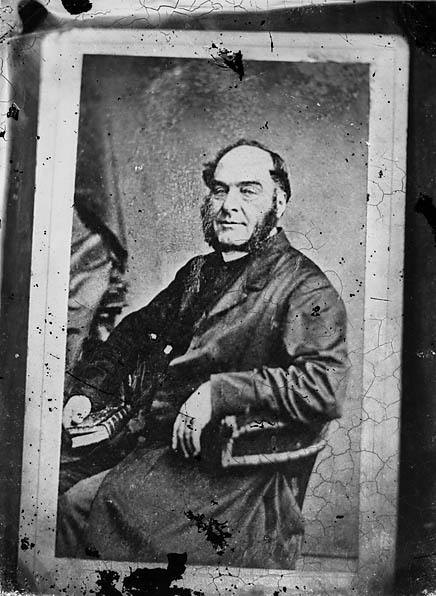 File:A man sitting and holding a book (copy) NLW3365003.jpg