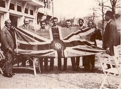 Indian hockey players holding the Star of India flag, 1928 Amsterdam Summer Olympics.