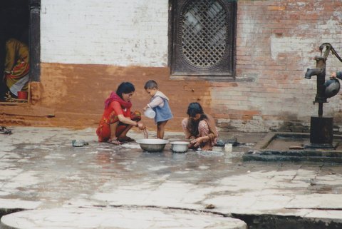 File:Mother and her two children do the dishes in Nepal.jpg