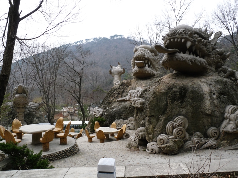 File:Picnic table and dragon head in North Korea.jpg