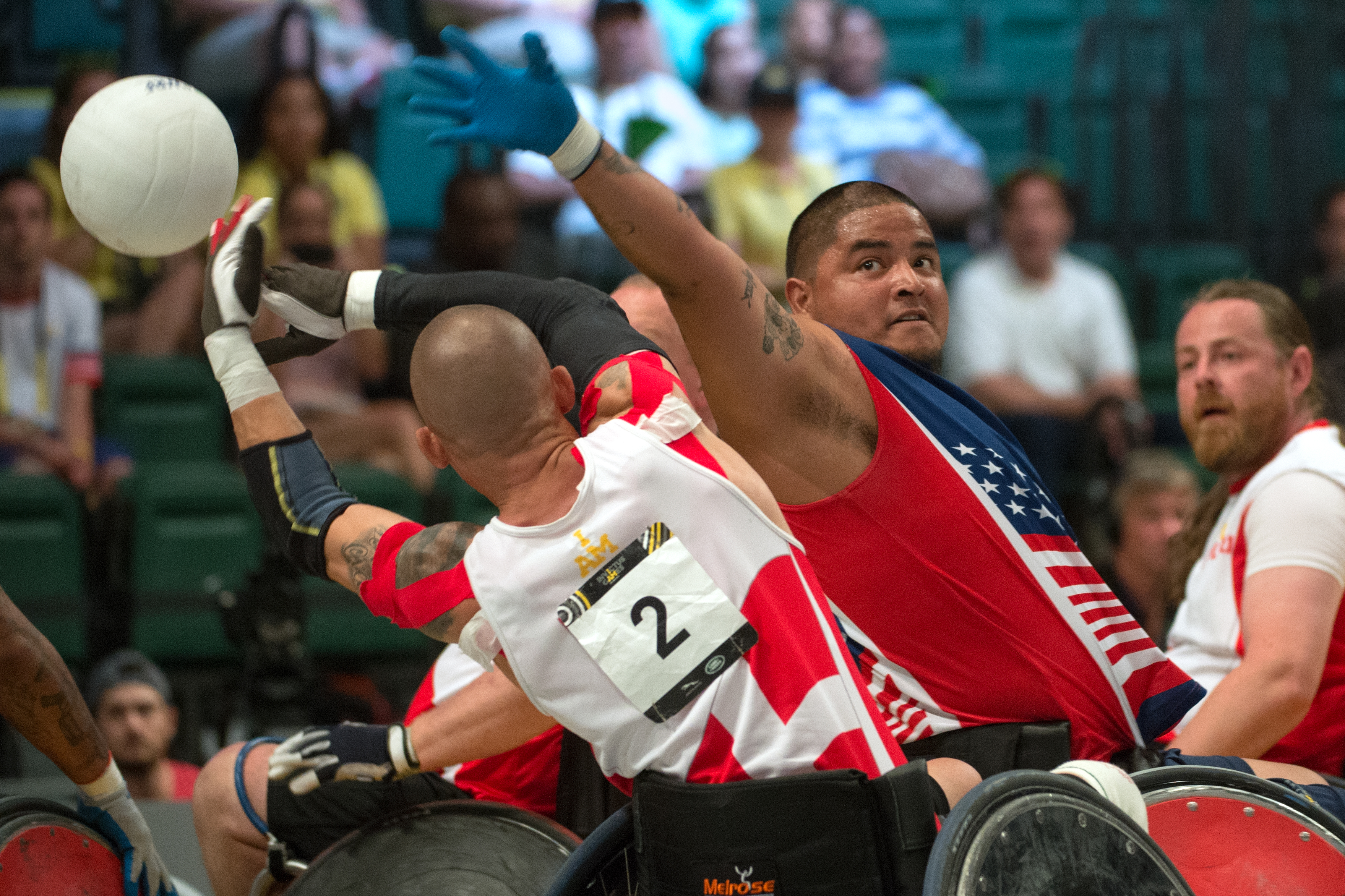 Retired U.S. Marine Corps Sgt. Alex Nguyen prevents a pass in the wheelchair rugby gold medal round of the 2016 Invictus Games (26965309675)