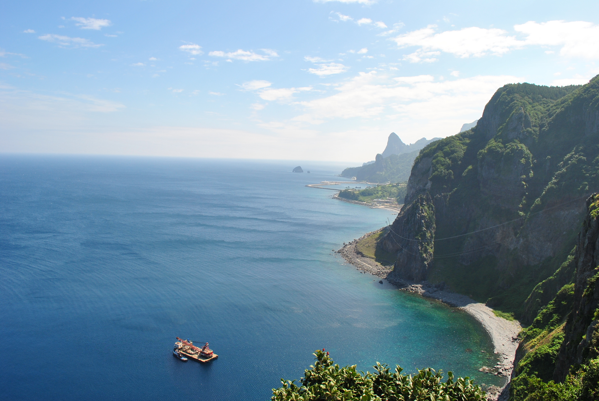 An island off the coast. Уллындо. Остров Уллындо. Японское море. Побережье японского моря.