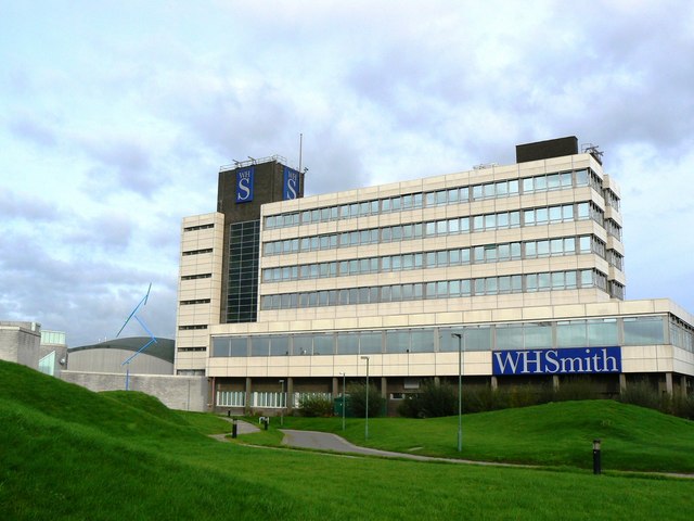 WH Smith PLC, trading as WHSmith (also written WH Smith, and known colloquially as Smith's and formerly as W. H. Smith & Son), is a British retailer, with headquarters in Swindon, England, which operates a chain of high street, railway station, airport, port, hospital and motorway service station shops selling books, stationery, magazines, newspapers, entertainment products and confectionery.
The company was formed by Henry Walton Smith and his wife Anna in 1792 as a news vendor in London. It remained under the ownership of the Smith family for many years and saw large-scale expansion during the 1970s as the company began to diversify into other markets. Following a rejected private equity takeover in 2004, the company began to focus on its core retail business. It was responsible for the creation of the ISBN book identifier.WHSmith is listed on the London Stock Exchange and is a constituent of the FTSE 250 Index.

