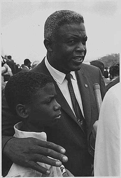 File:Civil Rights March on Washington, D.C. Former National Baseball League player, Jackie Robinson with his son., 08 28 1963.gif