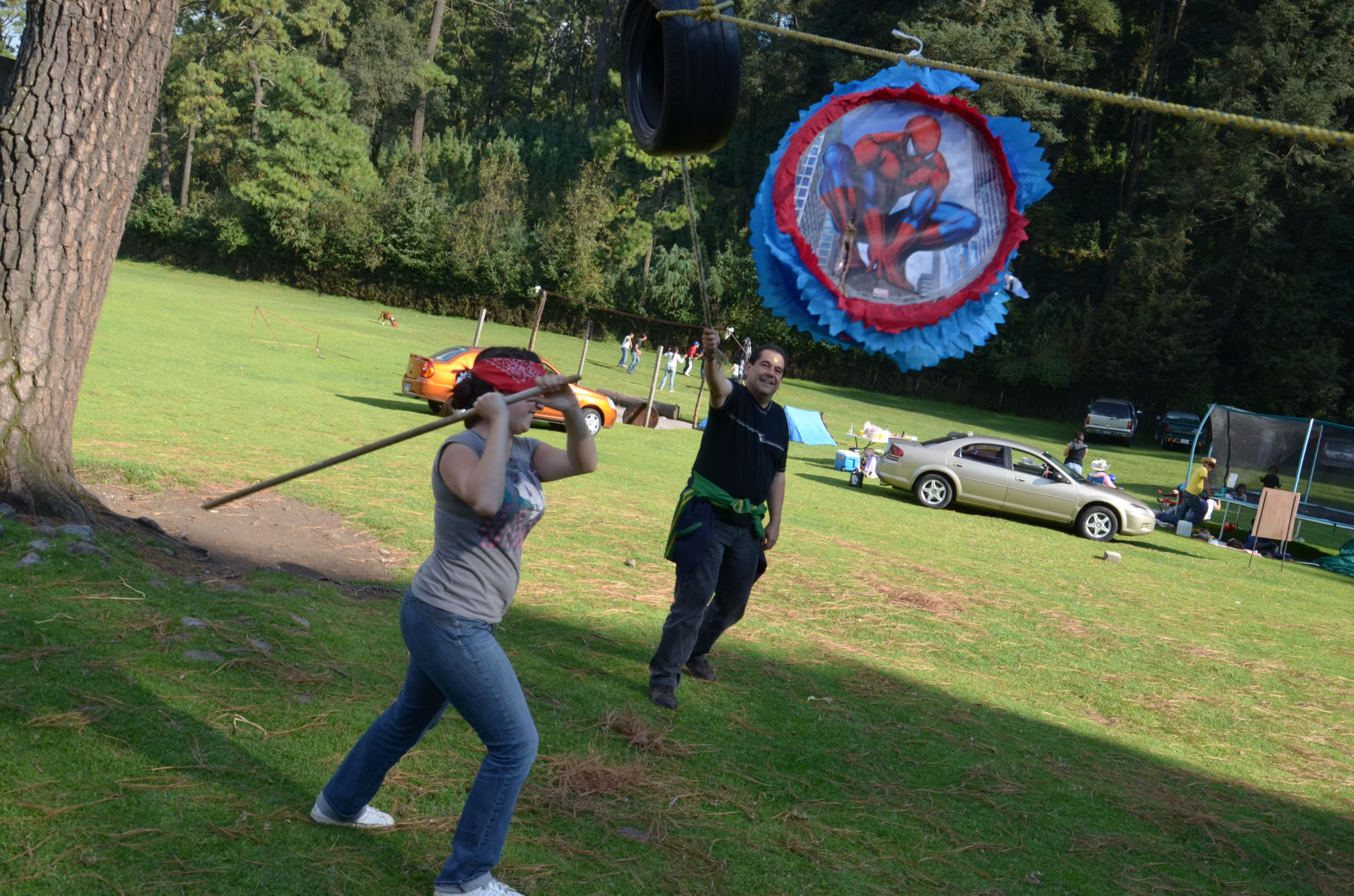 Adult woman playing piñata.jpg