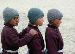 Three children after morning roll call. Druk white lotus school kid.jpg