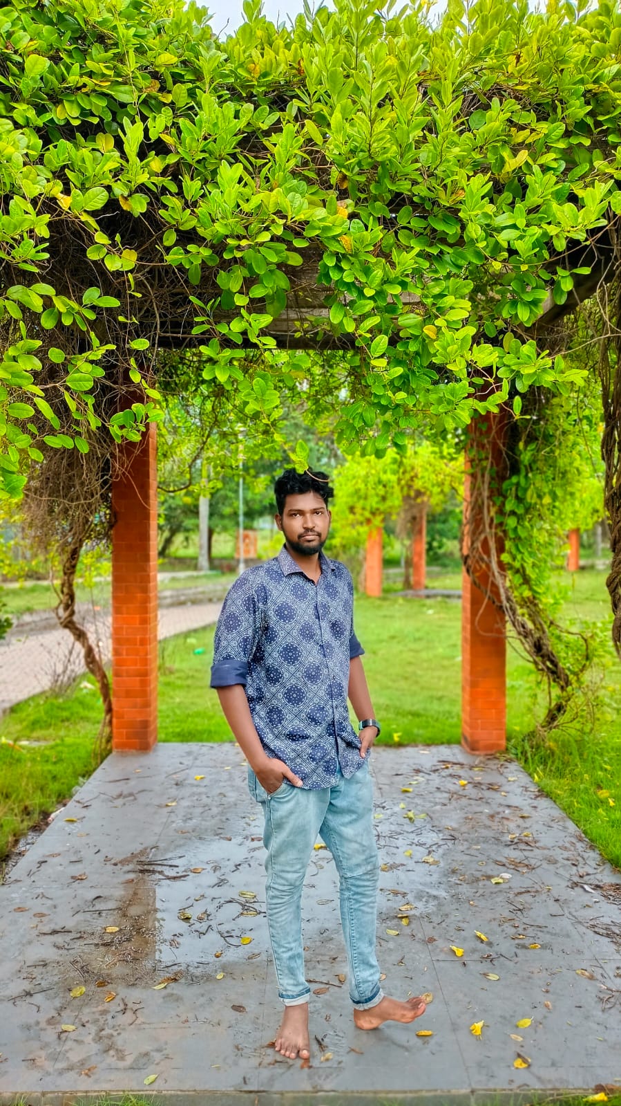 Young man with checked shirt posing in a garden, Pune, Maharashtra Stock  Photo - Alamy