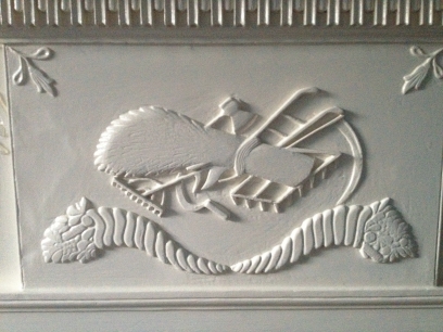 File:Detail of the Clover Forest mantel showing the agricultural implements..jpg