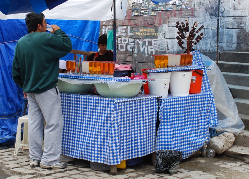 File:Drinking mocochinchi in market in La Paz.jpg