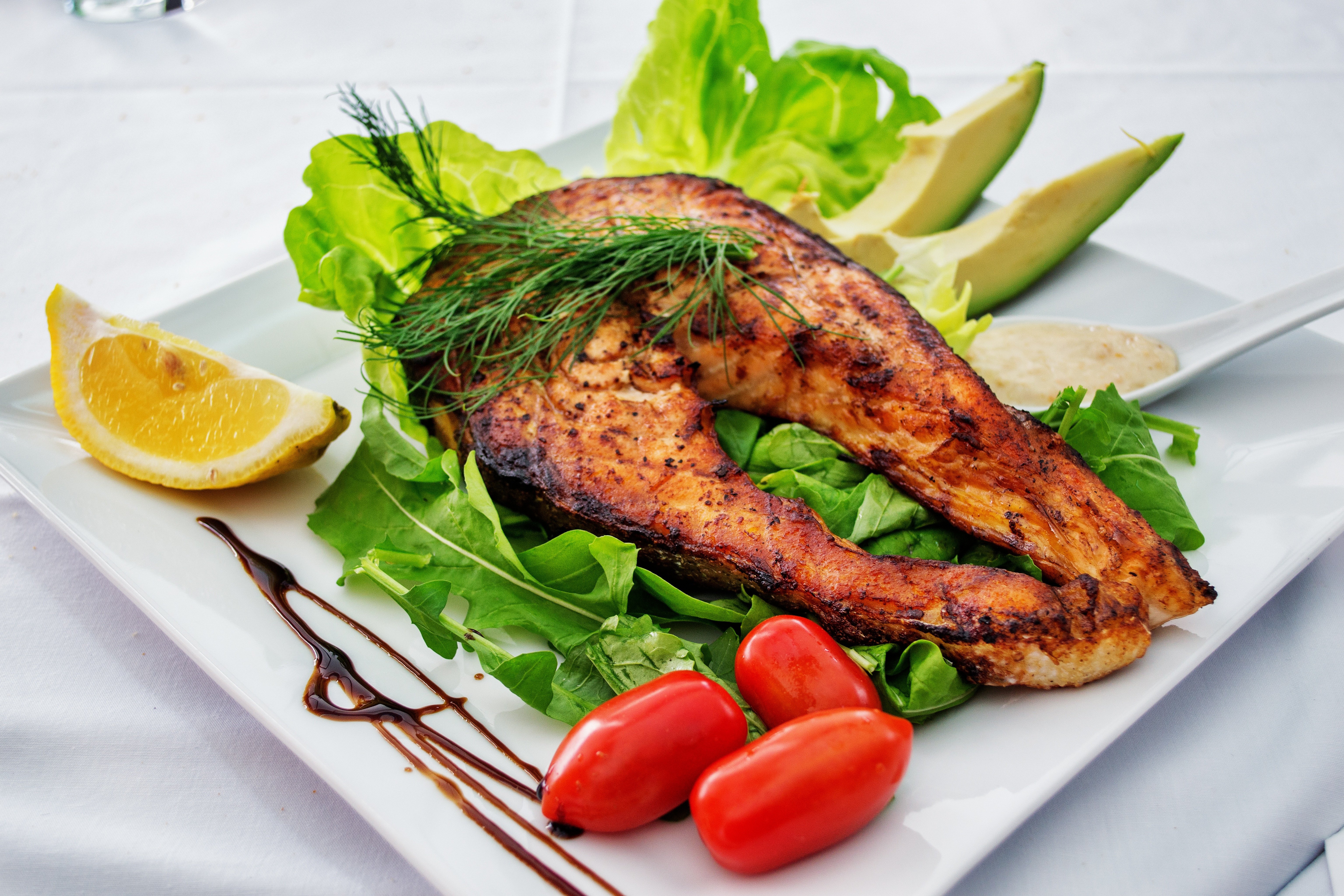 Fish, Trout, Chum Salmon, Humpback, A Piece Baked, Grilled, With A Slice Of  Lemon And Lettuce Stock Photo, Picture and Royalty Free Image. Image  125357561.