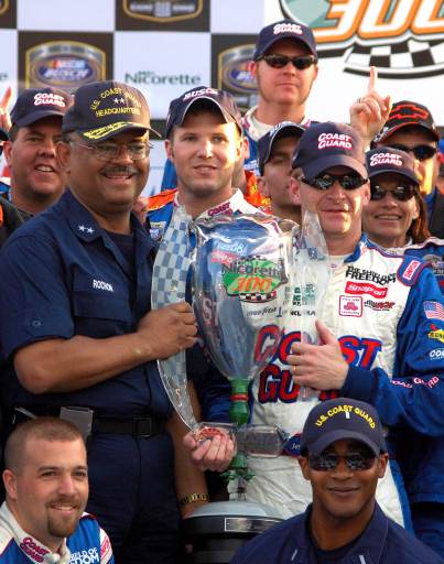 Stephen Rochon and Jeff Burton hold the victory trophy from 2006 Nicorette 300