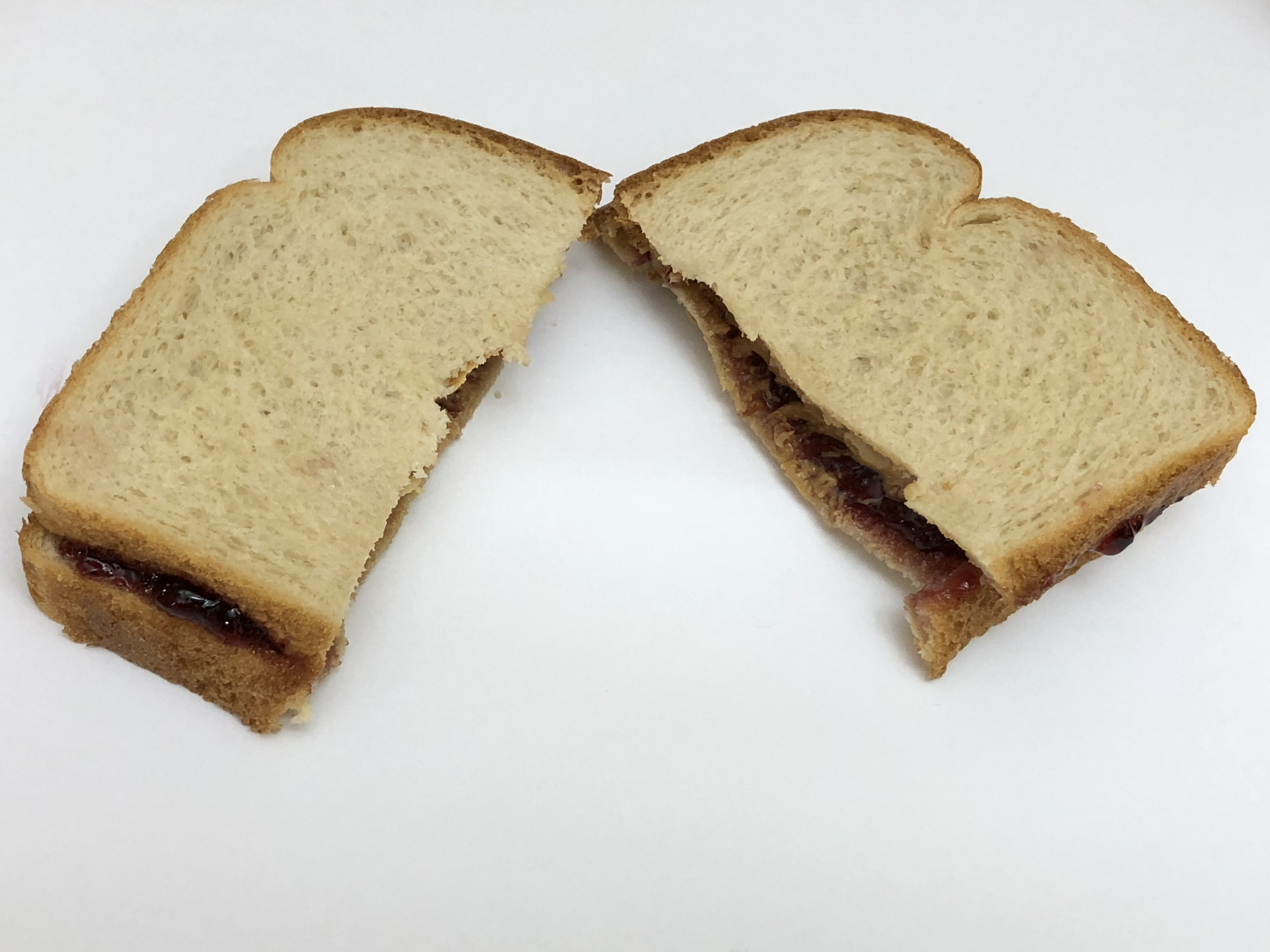 File 05 04 23 52 06 A Peanut Butter And Jelly Sandwich Cut In Two