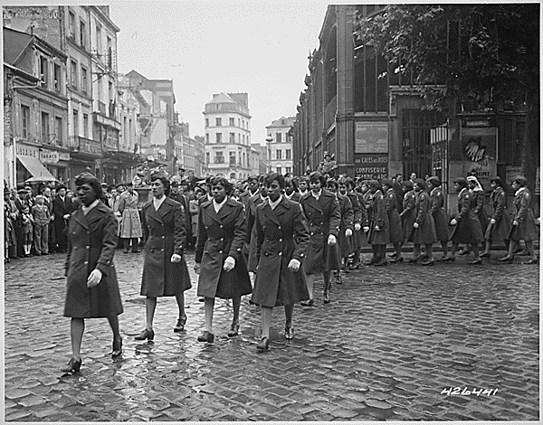 File:"Members of the 6888th Central Postal Directory Battalion take part in a parade ceremony in honor of Joan d'Arc at the marketplace where she was burned at the stake." - NARA - 531431.gif