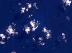 Satellite image of the island (center of the image, cloudy)