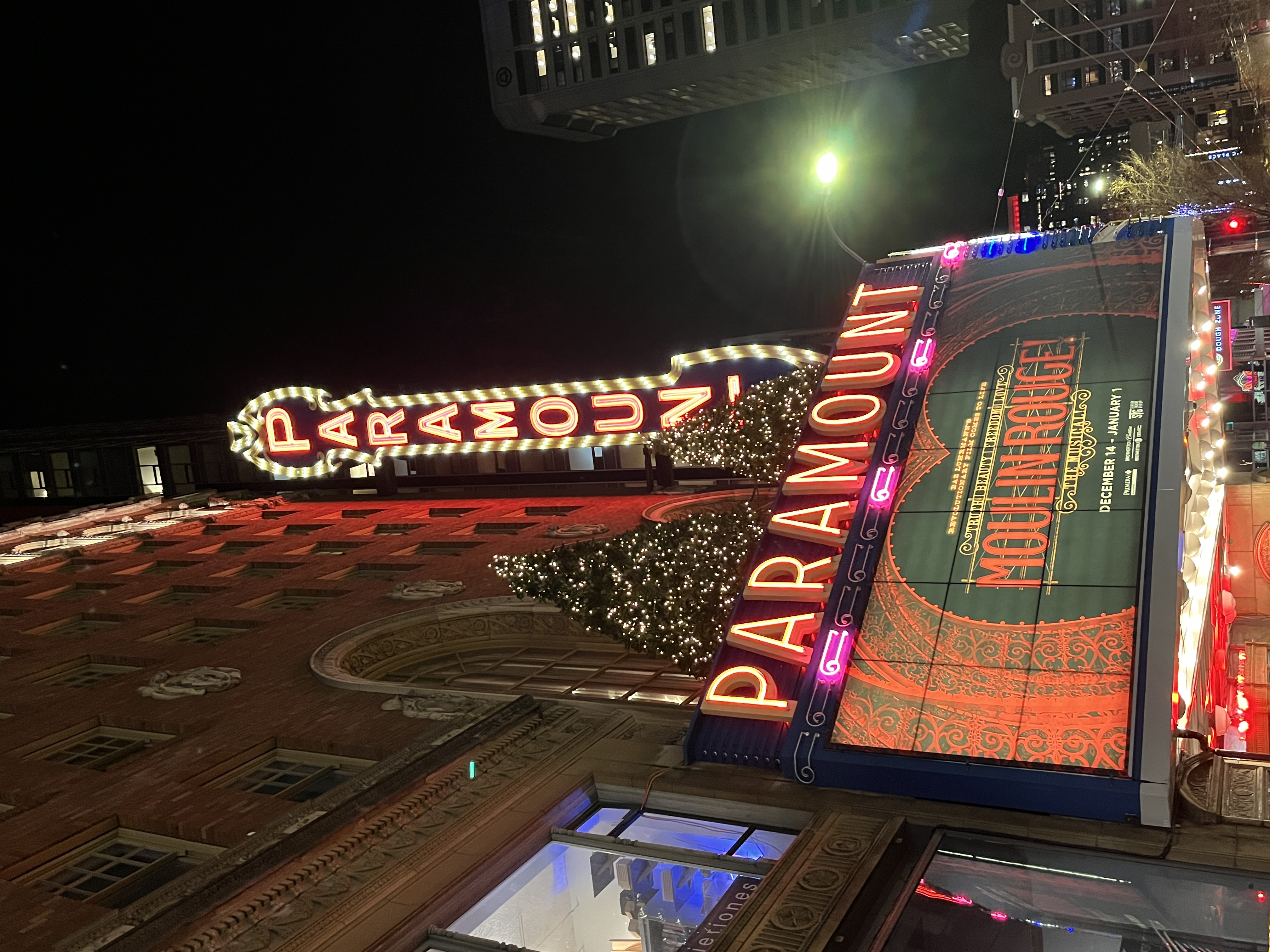 Paramount Theater Seattle Sign lit up at night with Moulin Rouge