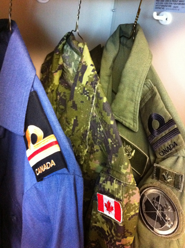 Operational dress uniforms for the three branches of the Canadian Armed Forces, shown here with naval rank insignia.