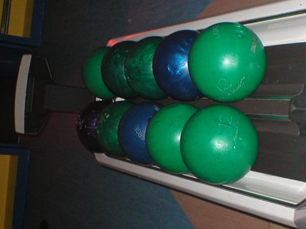 File:Bowling balls on rack.JPG