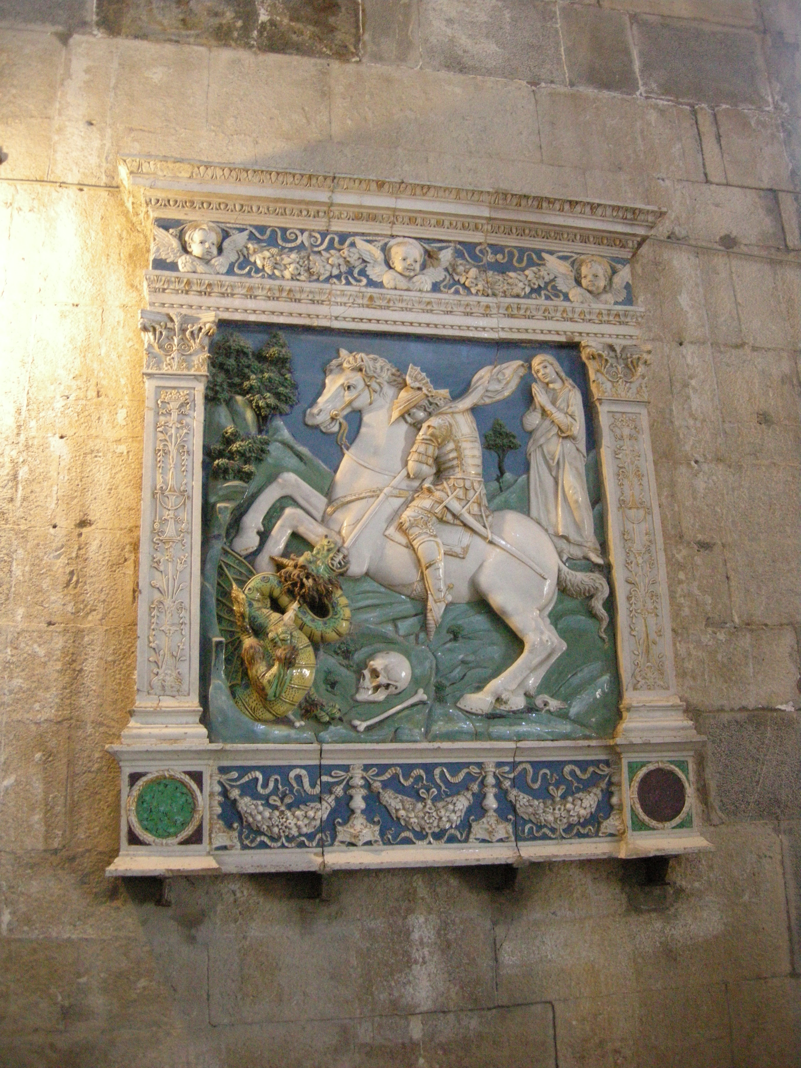 https://upload.wikimedia.org/wikipedia/commons/f/fa/Pieve_di_brancoli%2C_andrea_della_robbia%2C_san_giorgio%2C_la_principessa_e_il_drago_01.JPG