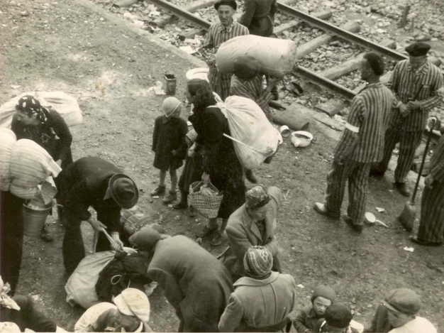 File:Birkenau mother and child on a platform after alighting from a train.jpg