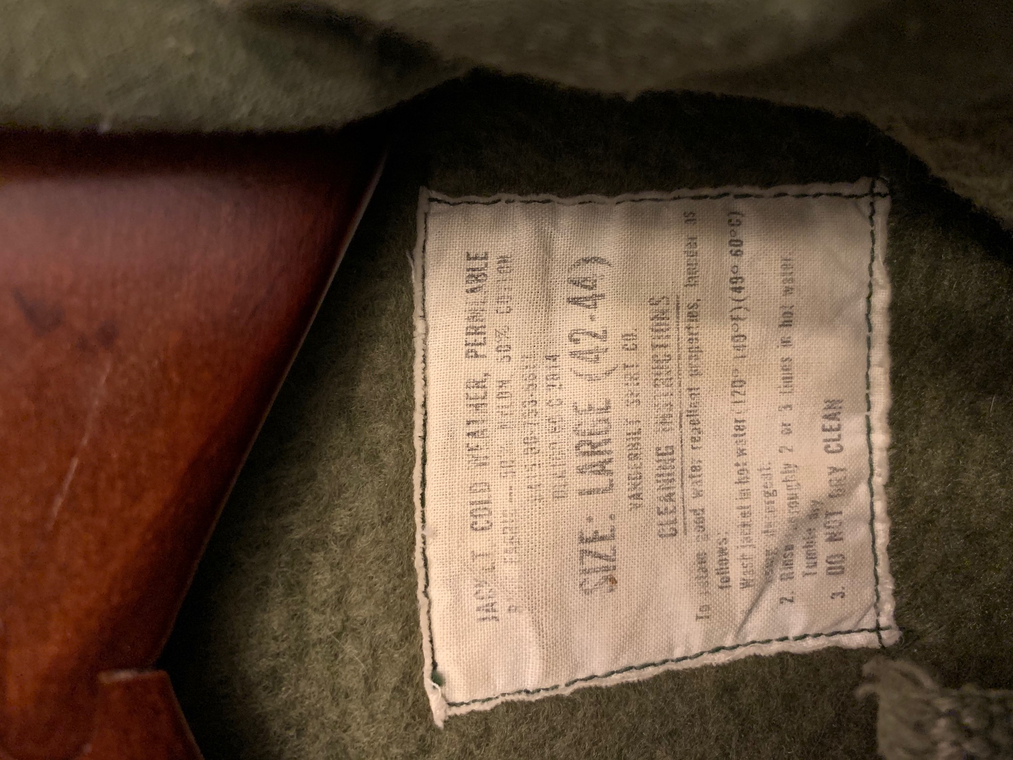 File:Clothing tag on Navy Issued Jacket, Cold Weather, Permeable built by  the Vanderbilt Shirt Company.jpg - Wikimedia Commons