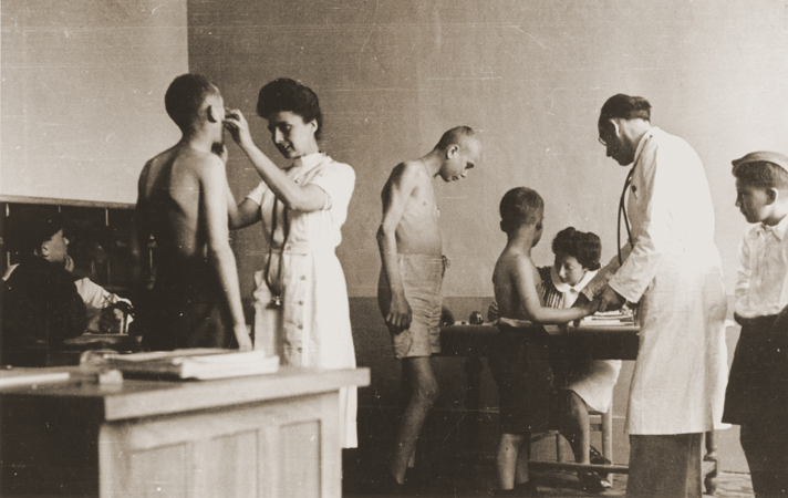 Brauner (left) examining Buchenwald children in 1945