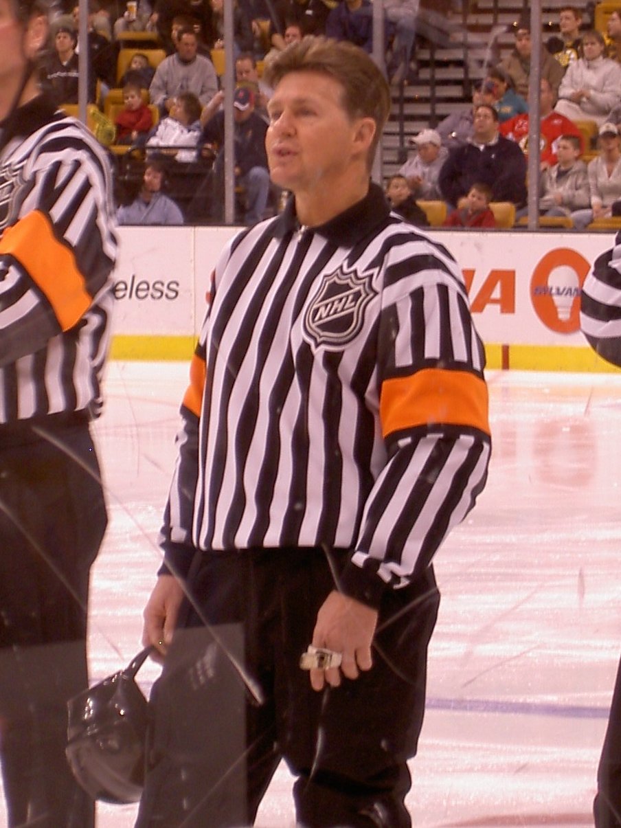 Nhl referee wearing philadelphia flyers jersey