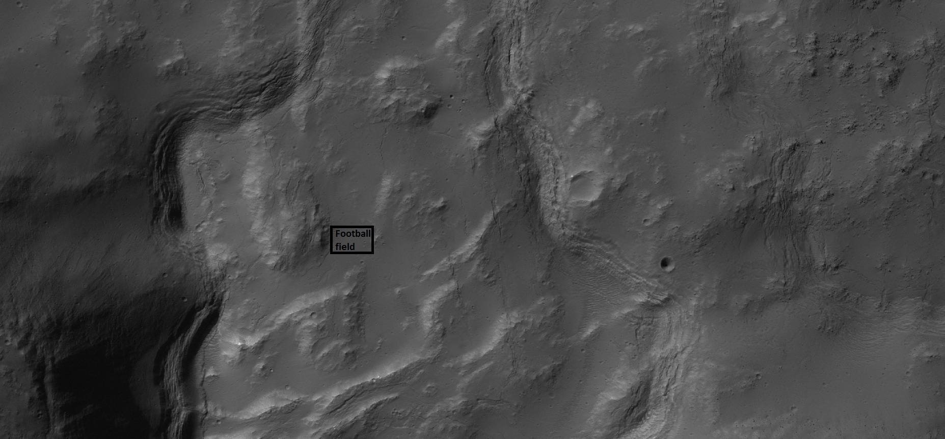 Close-up of depression on crater floor, as seen by HiRISE under HiWish program. Rectangle represents the size of a football field.