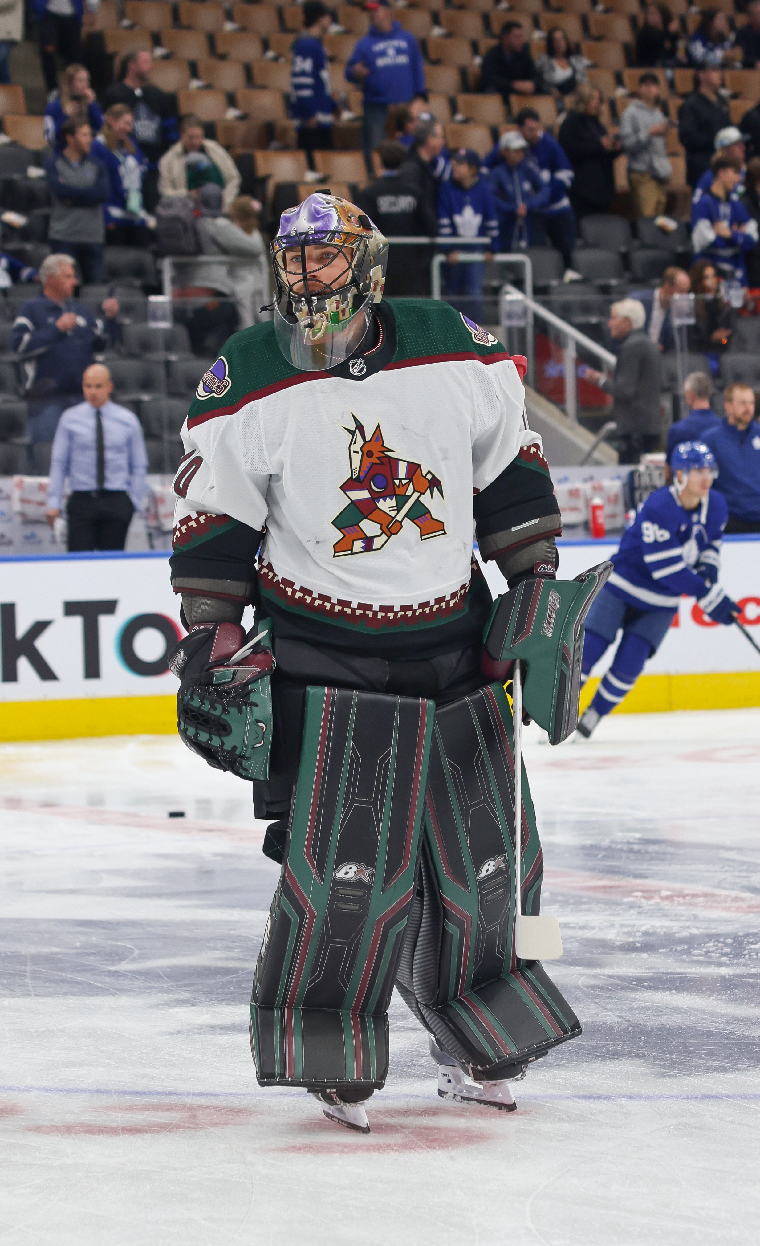 Arizona Coyotes goaltender Karel Vejmelka wears a helmet decorated with a  cross and a flag of the Czech Republic in an NHL hockey game against the  Seattle Kraken, Thursday, April 6, 2023